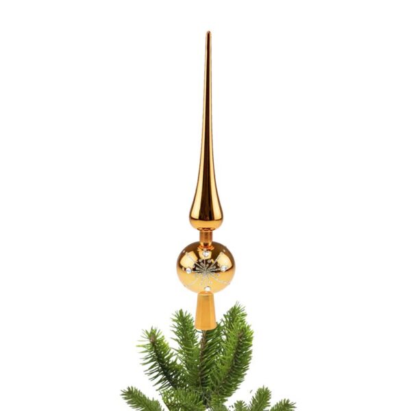 The gold finial tree topper is on the top of a Christmas tree