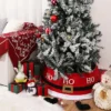The red Christmas tree collar on the Christmas tree is displayed on the corner