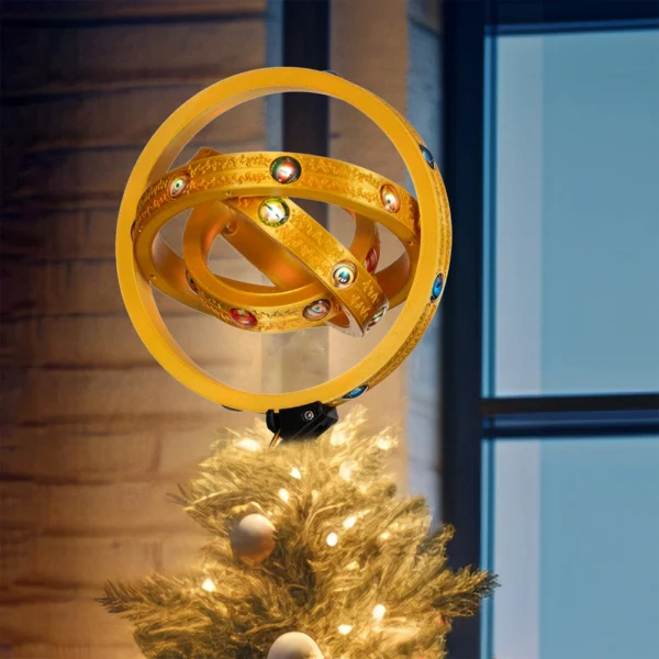 There is a thrones angel lighted on top of a Christmas tree