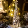 The style D glass Christmas tree desktop ornaments shining luminous night light glowing on a table