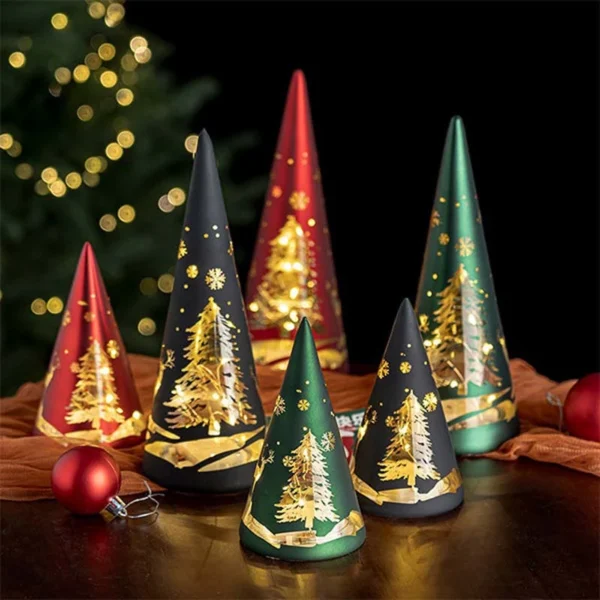There are six glass Christmas tree illuminated cone night lights on a table