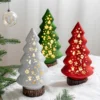 There are three glass christmas tree night light hotel window restaurant tabletop ornaments