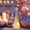 The LED light changing glass Christmas tree lighting on a table