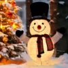 A glowing Snowman Christmas ornament yard decoration