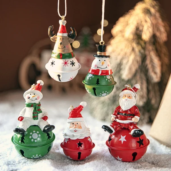 There are five painted jingle bells hanging Christmas ornaments