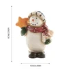 The height of painted Snowman resin figurine holding a star is 2.36in, width is 1.96in
