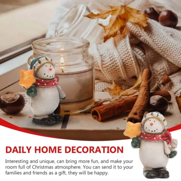 This painted Snowman resin figurine holding a star is a daily home decoration