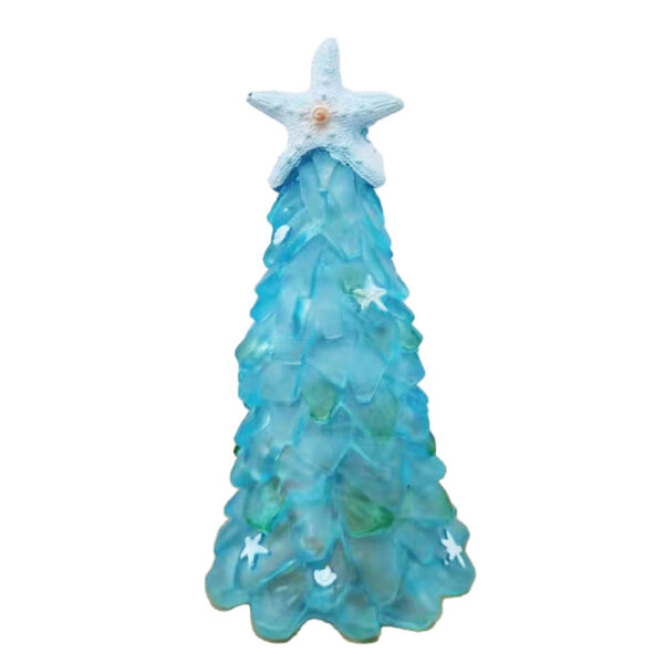 There is a blue glass Christmas tree