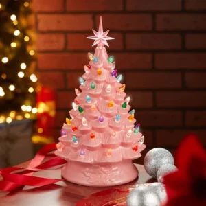 There is a 15" pink vintage ceramic Christmas tree on the desk