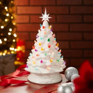 There is a 15" vintage white ceramic Christmas tree on the desk