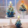 Three lighting blue ceramic ctarfish Christmas cree on a desk