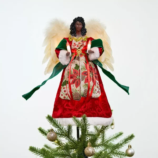 An African American Angel Tree Topper with Candle Lights on the top of a Christmas tree