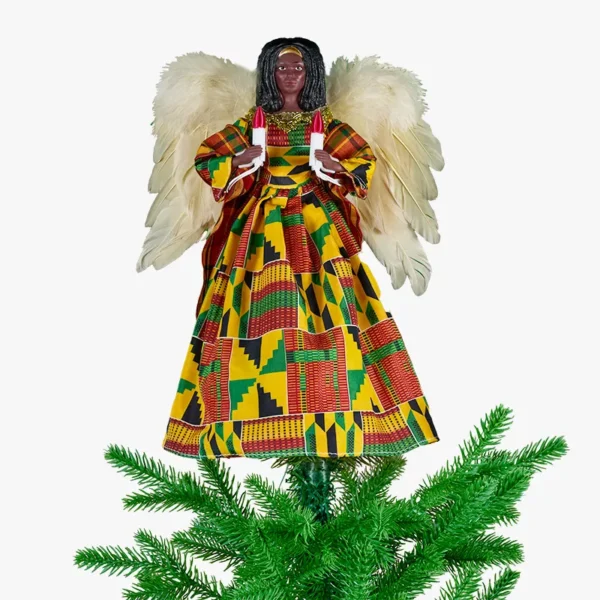 A black angel tree topper wearing kente dress on top of a Christmas tree