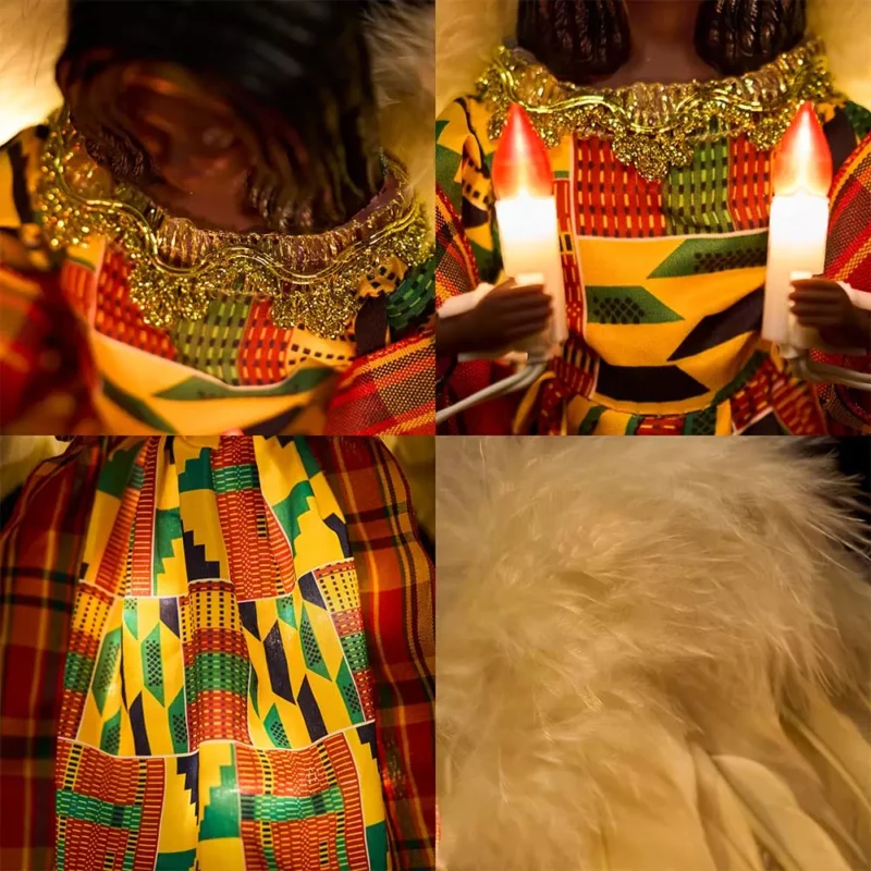 The details of black woman angel tree topper dressed with kente cloth