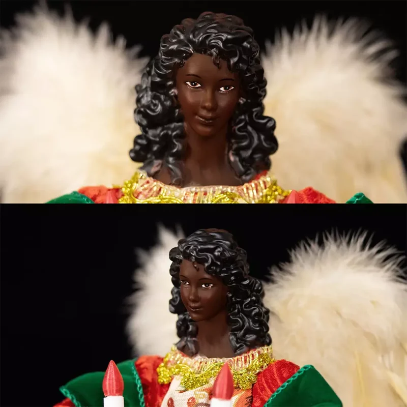 The face of the black woman angel tree topper dressed with red cloth