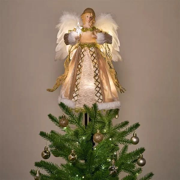 A gold animated angel christmas tree topper on a Christmas tree