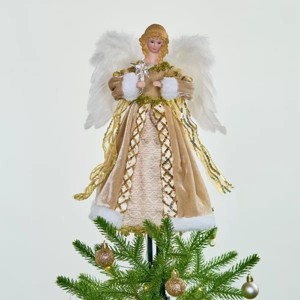 A gold animated angel christmas tree topper on a Christmas tree