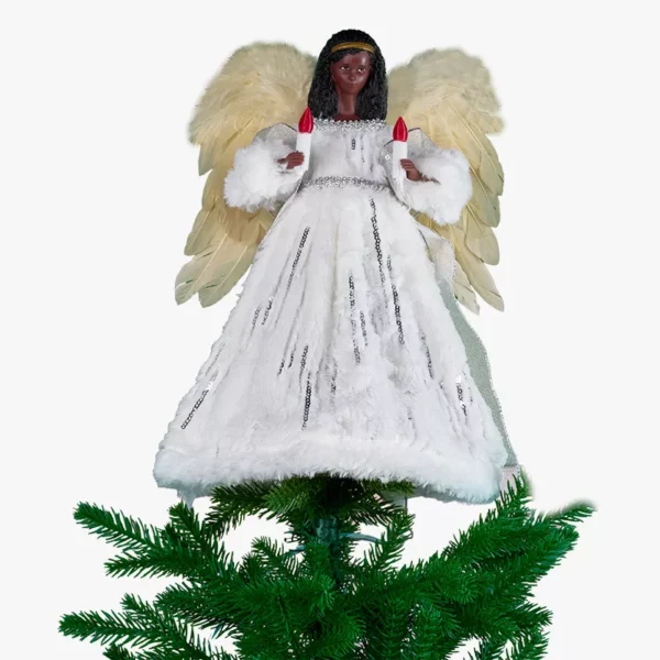 A silver african american angel on top of a Christmas tree