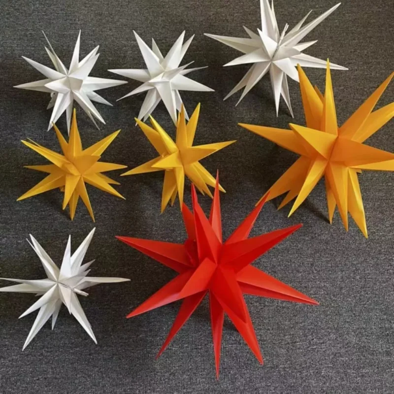 There are 8 moravian star hanging lights in white, red, and yellow