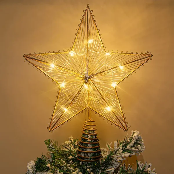 A shining 5-pointed star tree topper stands on a tree.