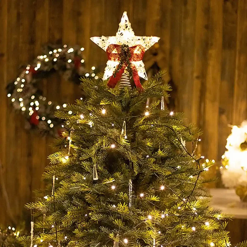 A warm light star tree topper stands on the tree.