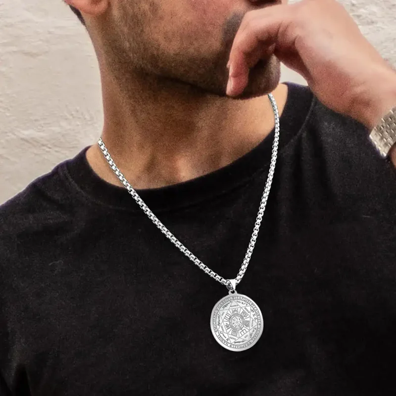 A man wears a silver Seven Archangels pendant.