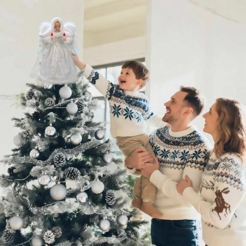 Heartwarming Christmas moment: father helps boy put angel tree topper while mother looks on smiling