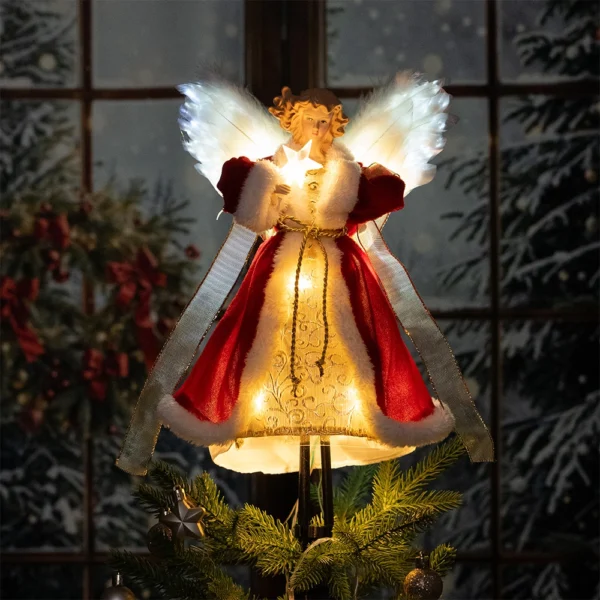 There is a 12″ fiber optic angel christmas tree topper lighting on top of a Christmas tree