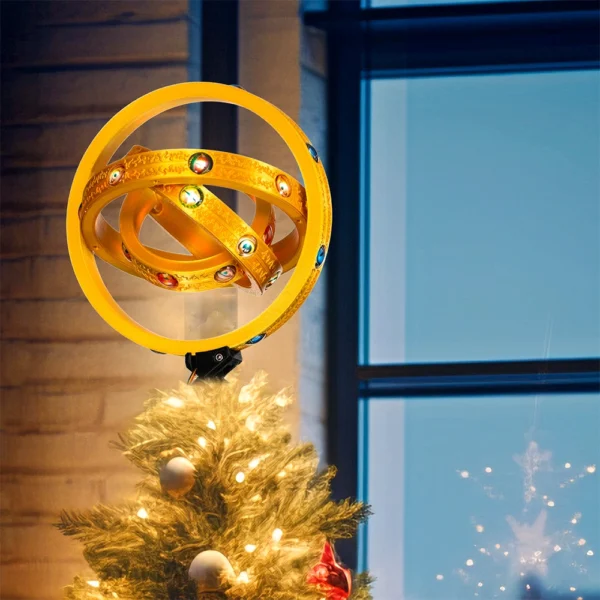 There is a thrones angel lighted on top of a Christmas tree